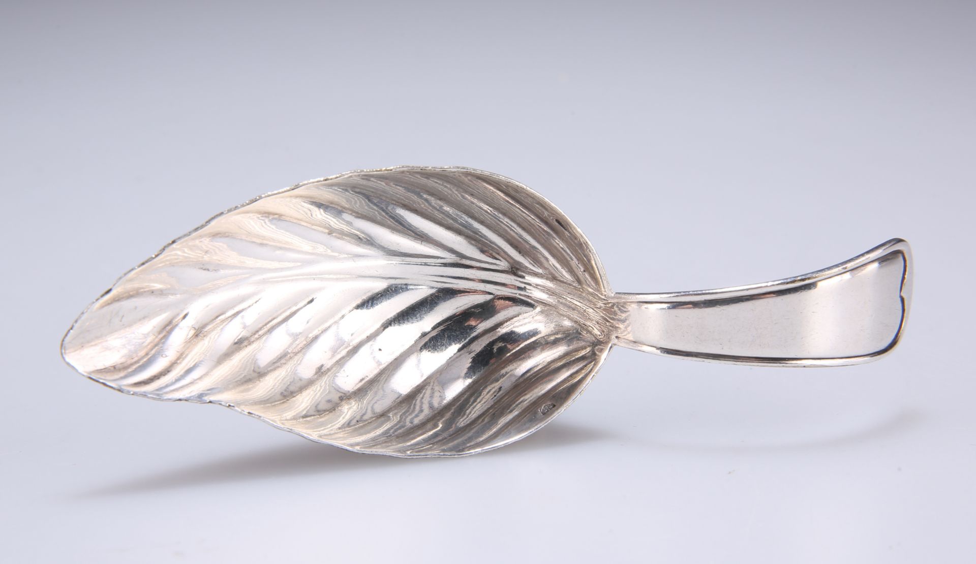 A CHRISTOFLE SILVER-PLATED CADDY SPOON