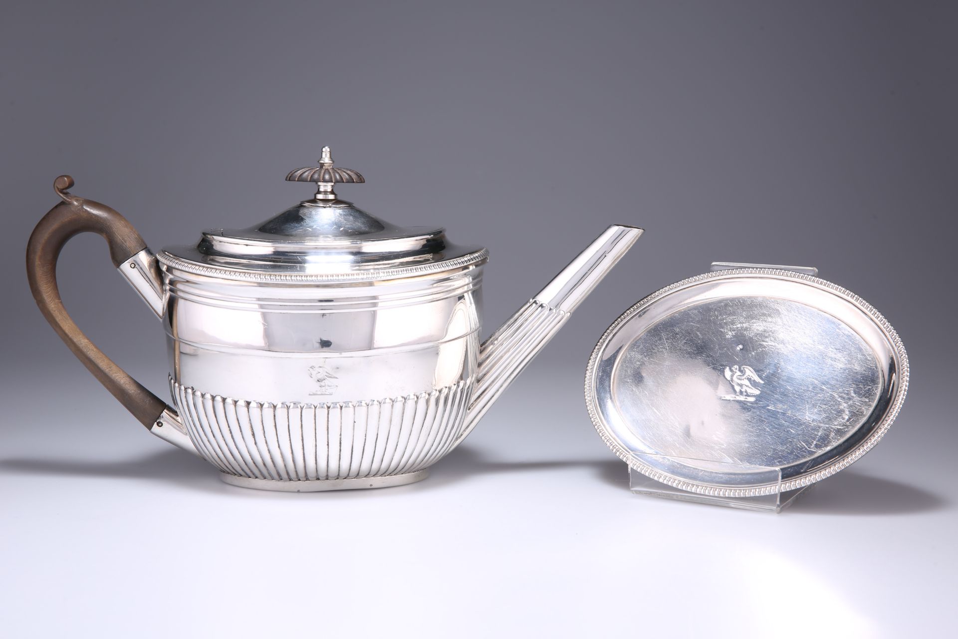 A GEORGE III SILVER TEAPOT