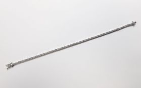 A DIAMOND TENNIS BRACELET