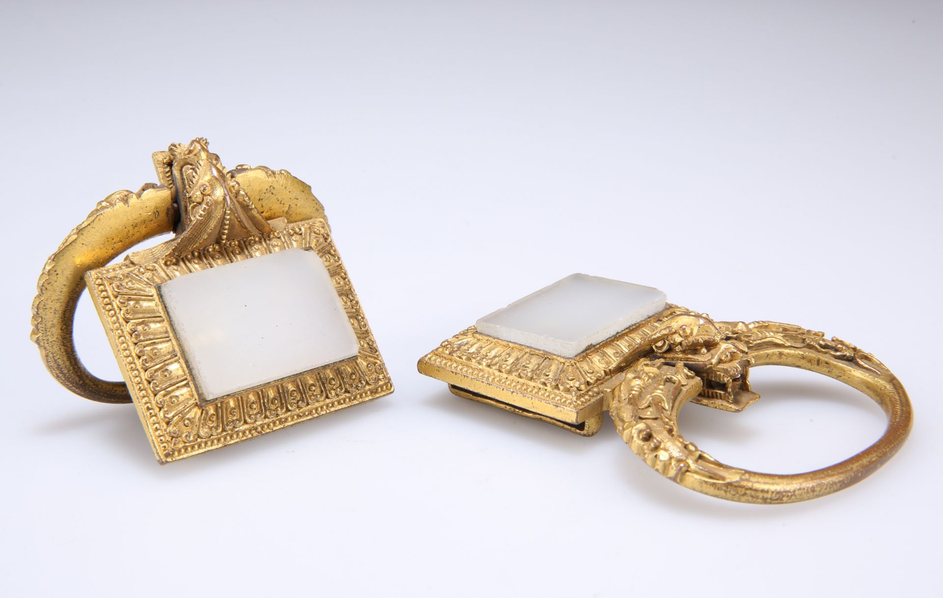 A PAIR OF 19TH CENTURY CHINESE GILT-METAL BUCKLES