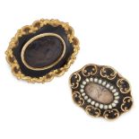 TWO VICTORIAN HAIRWORK AND ENAMEL MOURNING BROOCHES