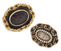 TWO VICTORIAN HAIRWORK AND ENAMEL MOURNING BROOCHES