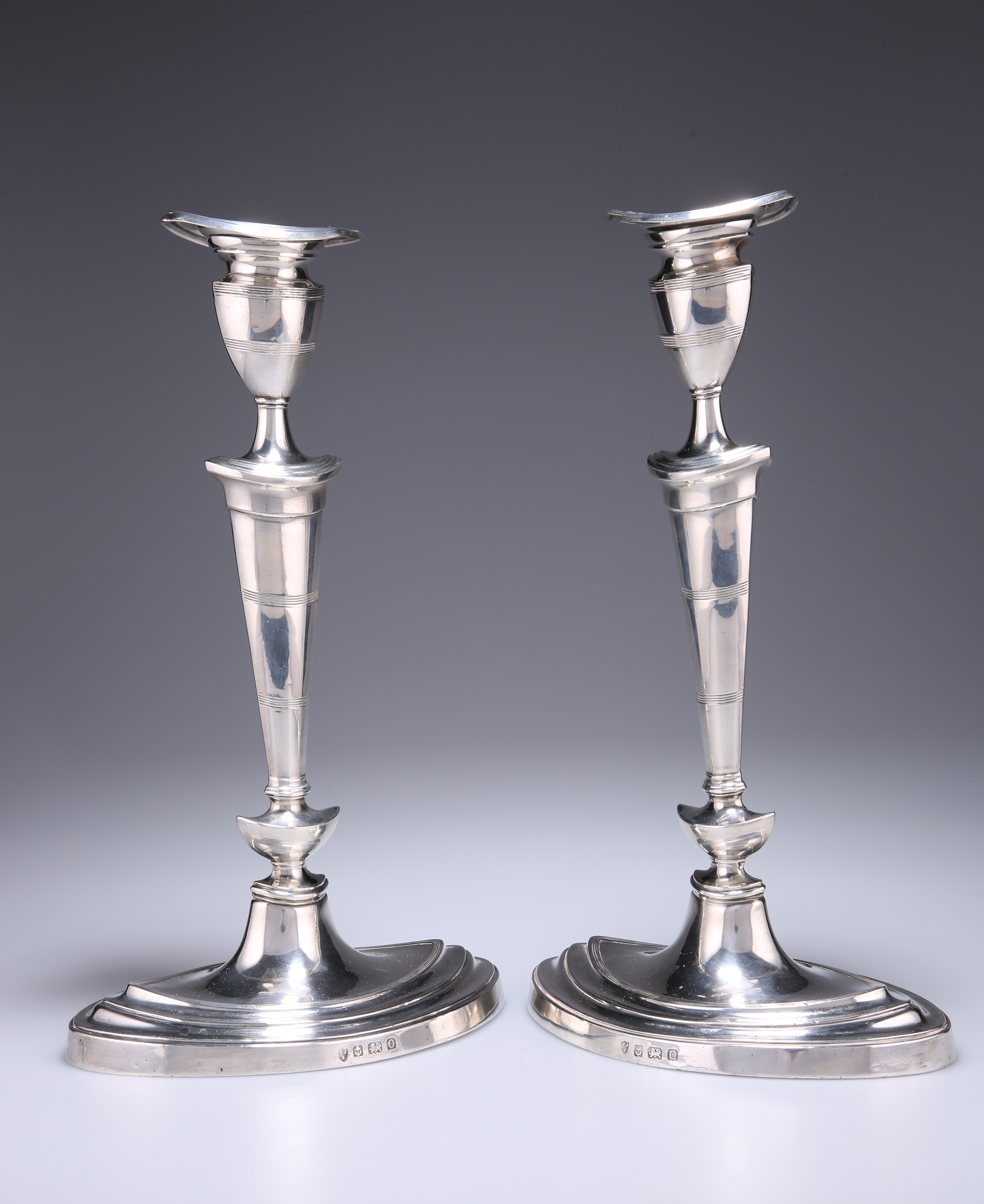 A PAIR OF GEORGE V SILVER CANDLESTICKS, by Ellis Jacob Greenberg, Birmingham 1913, in Adam style,