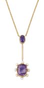 AN AMETHYST AND SEED PEARL PENDANT, an oval-cut am