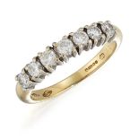 AN 18CT GOLD DIAMOND HALF HOOP RING