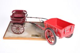 A model of an Offord Governess Cart, on a plinth base with brass plaque inscribed 'Offord