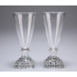 A pair of wine glasses, c1810, each funnel bowl issuing from a square lemon squeezer base, 12cm