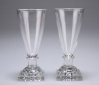 A pair of wine glasses, c1810, each funnel bowl issuing from a square lemon squeezer base, 12cm