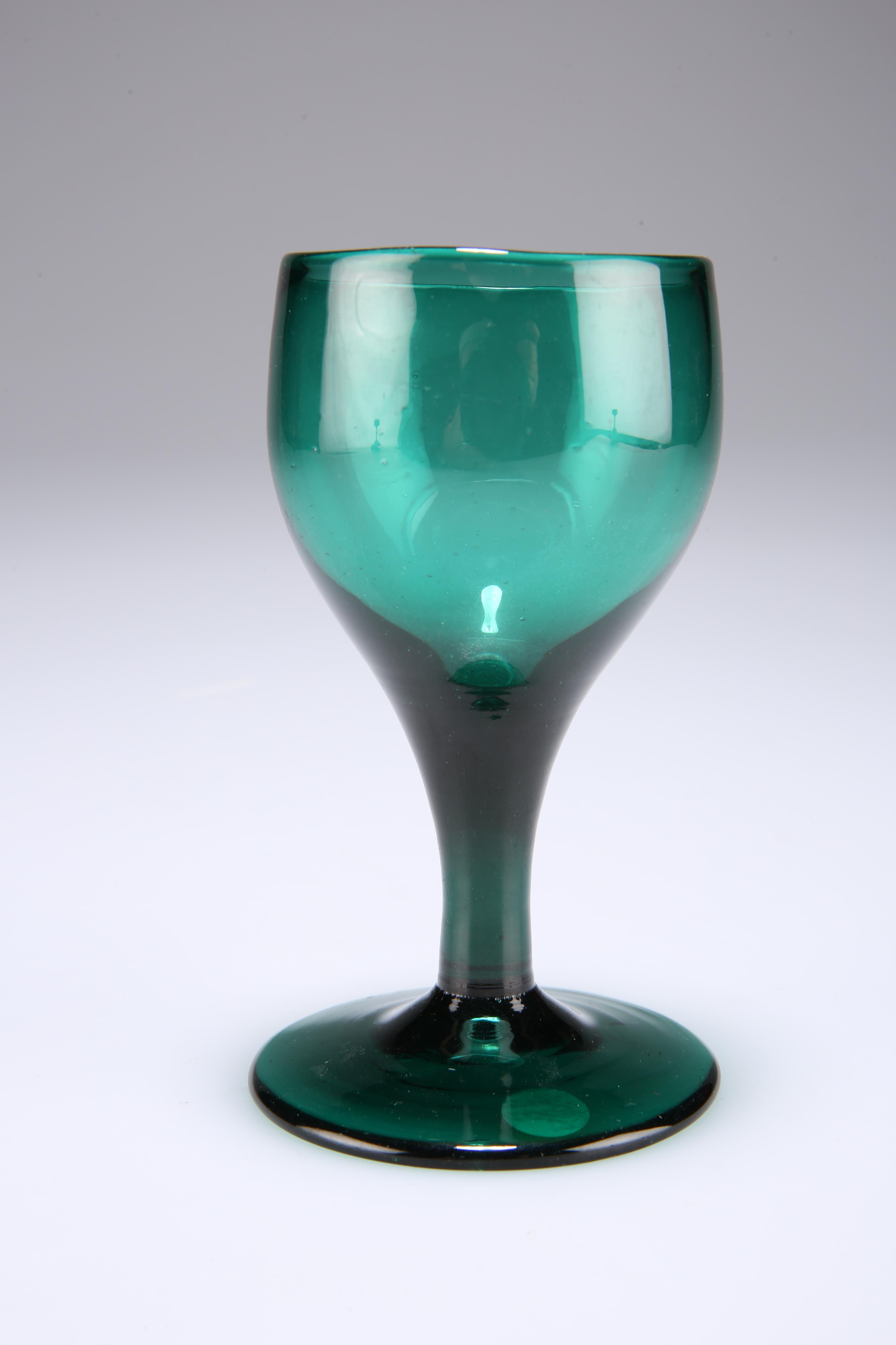 An 18th century deep green drinking glass, 12cm high