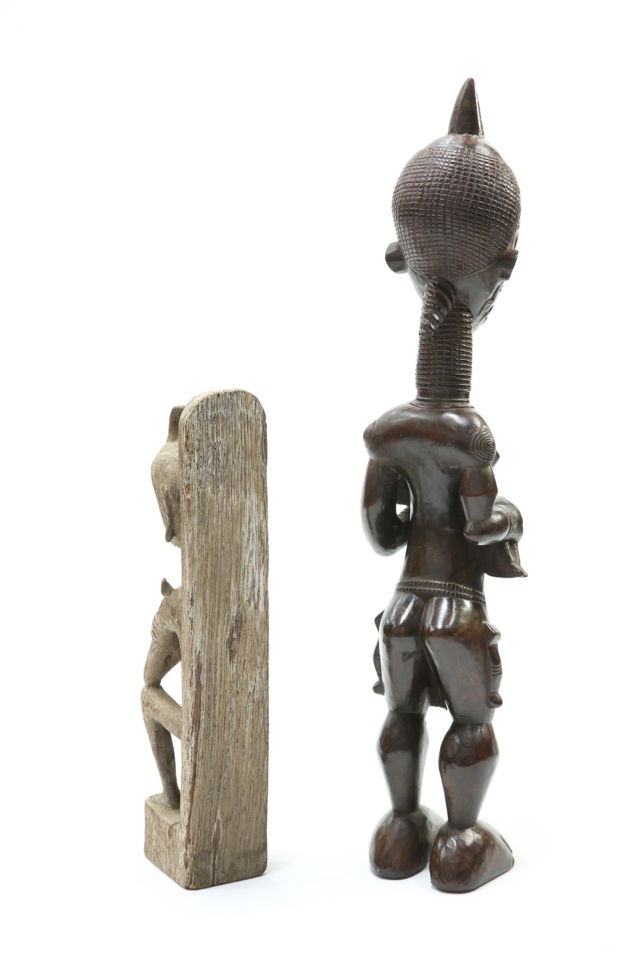 Two tribal carved figures, the first modelled as a mother and child, the first 72cm high - Image 2 of 2