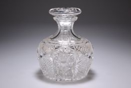 AN EARLY 20TH CENTURY CUT-GLASS DECANTER, the squat body with heavy diamond cutting. 16cm high