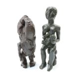 Two carved tribal figures, the first modelled as a mother and child, height of tallest 51cm