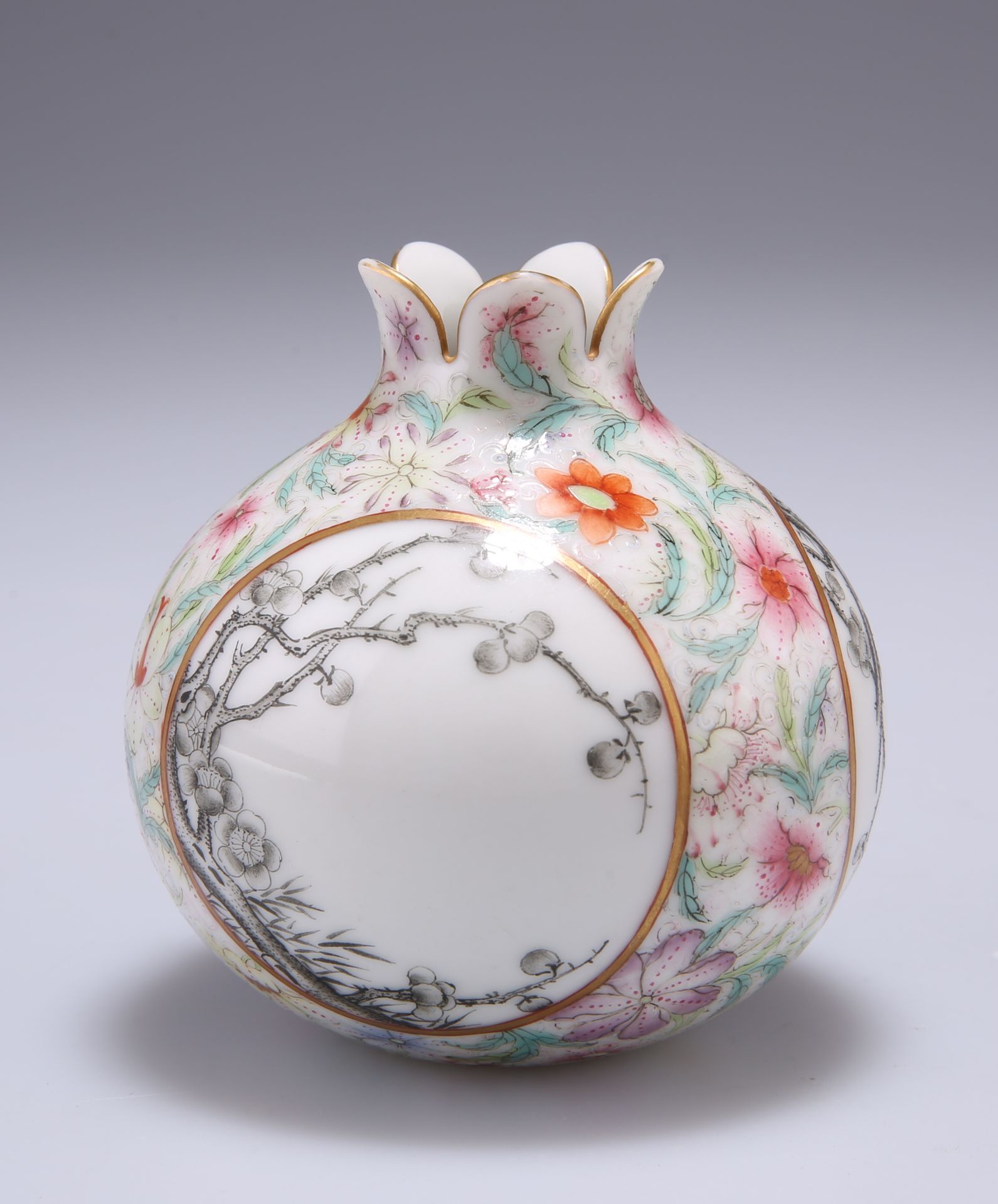 A CHINESE FAMILLE ROSE 'POMEGRANATE' VASE, decorated en grisaille to three circular reserves with