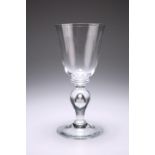 A VERY LARGE WINE GLASS, with bucket bowl sat on a ring. 21.6cm high Provenance: The Chris