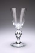 A VERY LARGE WINE GLASS, with bucket bowl sat on a ring. 21.6cm high Provenance: The Chris