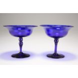 A pair of Bristol blue glass pedestal bowls, each flared bowl raised on a knot tapering stem, 11.5cm