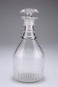 A 19th century spirit or cordial decanter, the body with slice cut shoulder and triple ring neck,