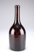 A 19th century glass bottle, of mallet shape the glass of deep red/brown colour, the base with a