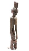 A large carved tribal figure, 122cm high