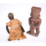 A tribal earthen ware figure; together with a doll and a bust applied with shells, earthen ware