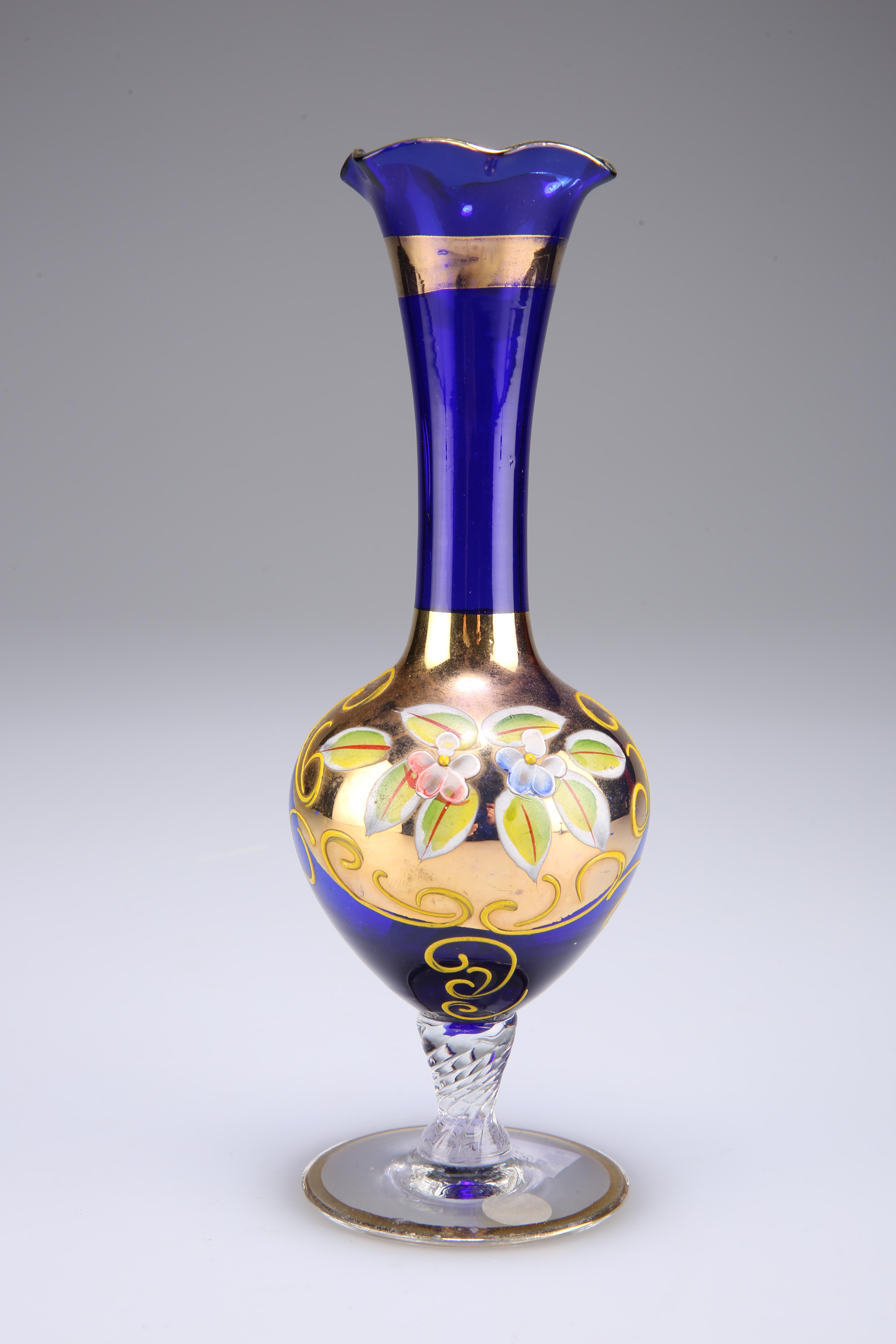 A Murano glass specimen vase, the blue glass body gilded and enamel painted with foliage, 18cm high