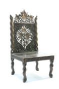 A tribal carved chair with pierced back, 93cm high