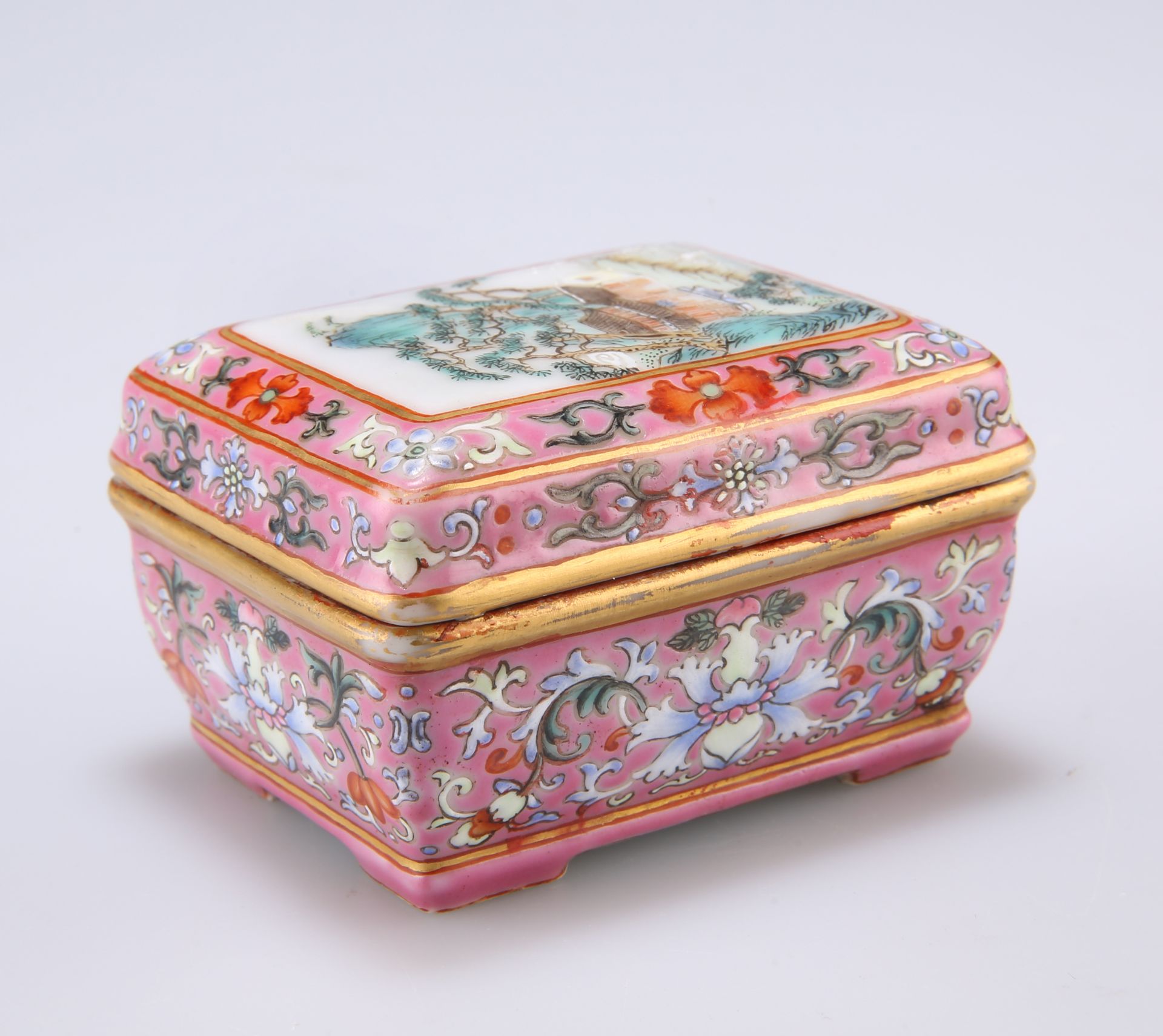 A SMALL CHINESE FAMILLE ROSE BOX AND COVER, rectangular, the cover painted with a village by a