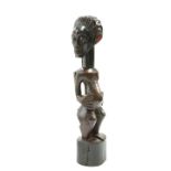 A tribal carved figure, 69cm high