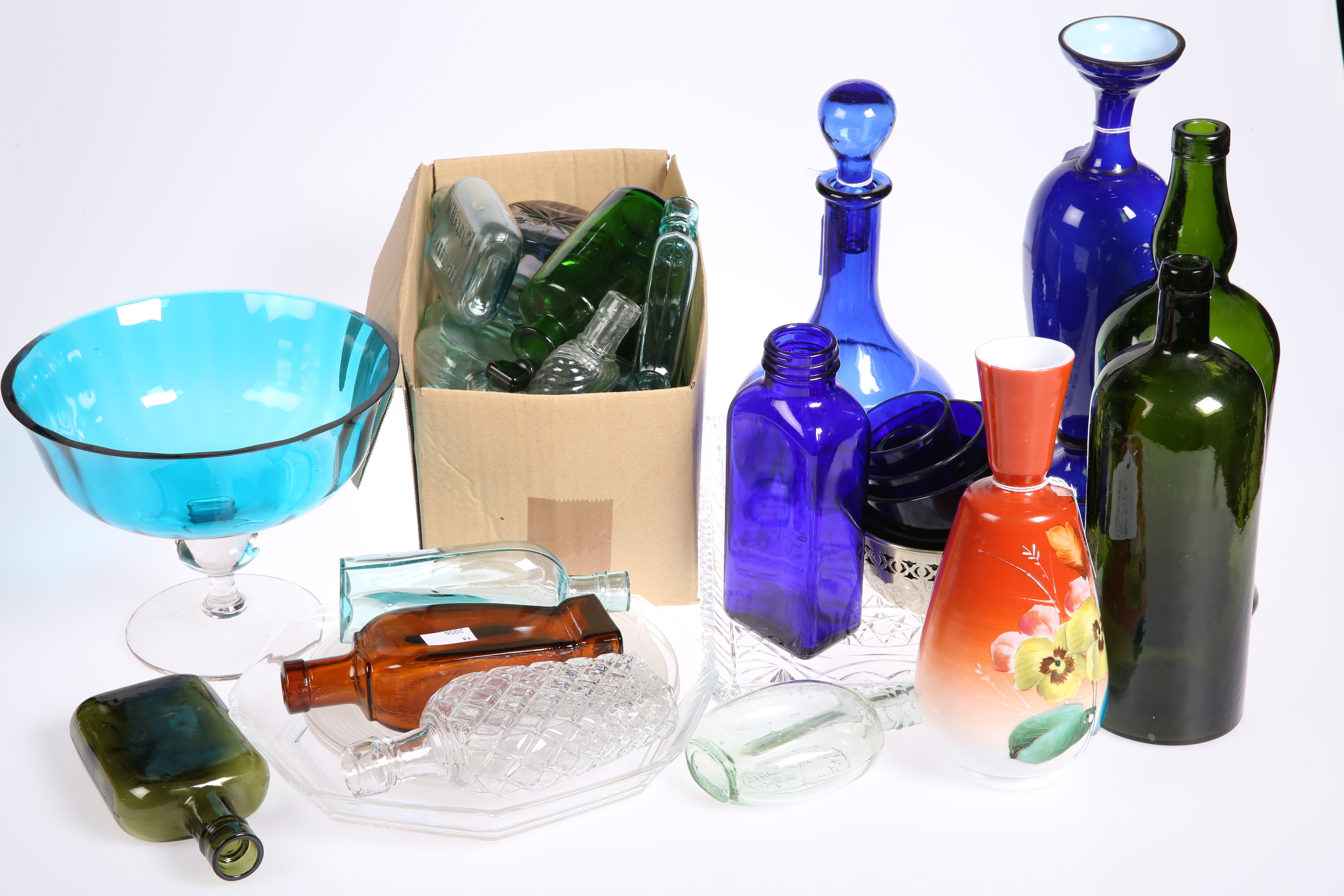 A group of glass inc. Victorian painted blue cased-glass vase, bottles, decanters, etc