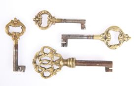 Four antique brass mounted keys, largest 8.5cm