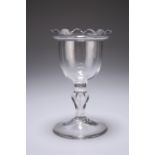 A SWEETMEAT GLASS, CIRCA 1765, the ogee bowl with frilled rim, raised on a baluster stem. 15.5cm