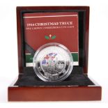 A 1914 CHRISTMAS TRUCE ONE CROWN COMMEMORATIVE COIN, boxed with COA