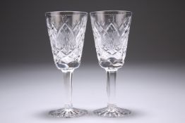 A PAIR OF WATERFORD SHERRY OR PORT GLASSES, with extensive cutting to the bodies, signed. 13cm