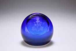 A BRISTOL BLUE GLASS PAPERWEIGHT, the slice-cut facade etched with a crest. 6.5cm high Provenance: