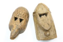 Two carved tribal masks, highest 33cm