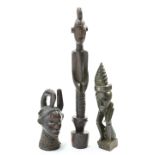Three carved tribal figures including one with hammered in nails, tallest, 82cm