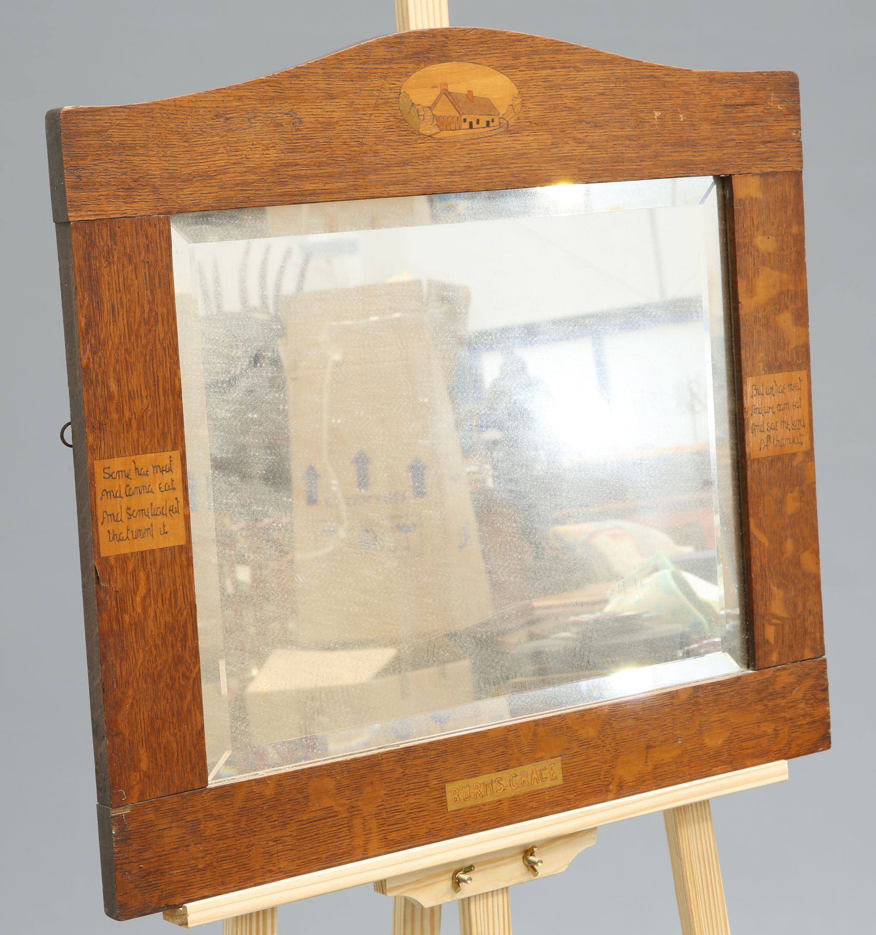 AN ARTS AND CRAFTS OAK MOTTO MIRROR, CIRCA 1900