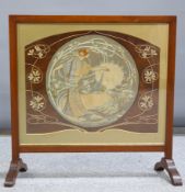 AN ART NOUVEAU WALNUT FRAMED FIRESCREEN