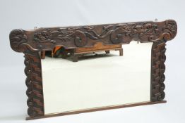 A LARGE ARTS AND CRAFTS CELTIC REVIVAL OAK OVERMANTEL MIRROR