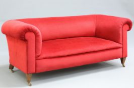 A HOWARD AND SONS RED VELVET UPHOLSTERED MAHOGANY SOFA