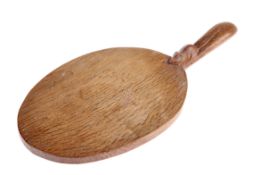 ROBERT THOMPSON OF KILBURN, A MOUSEMAN OAK CHEESEBOARD