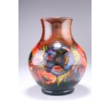 WILLIAM MOORCROFT AN ANEMONE PATTERN FLAMBE TUBE LINED POTTERY VASE