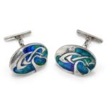 A PAIR OF ARCHIBALD KNOX (1864-1933) FOR LIBERTY & CO, CYMRIC SILVER AND ENAMEL CUFFLINKS