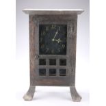 AN AMERICAN ARTS AND CRAFTS OAK MANTEL CLOCK