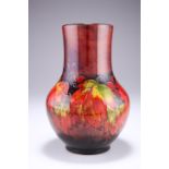 WILLIAM MOORCROFT A LEAVES AND BERRIES PATTERN FLAMBE TUBE LINED POTTERY VASE