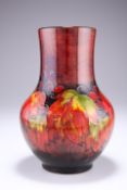 WILLIAM MOORCROFT A LEAVES AND BERRIES PATTERN FLAMBE TUBE LINED POTTERY VASE