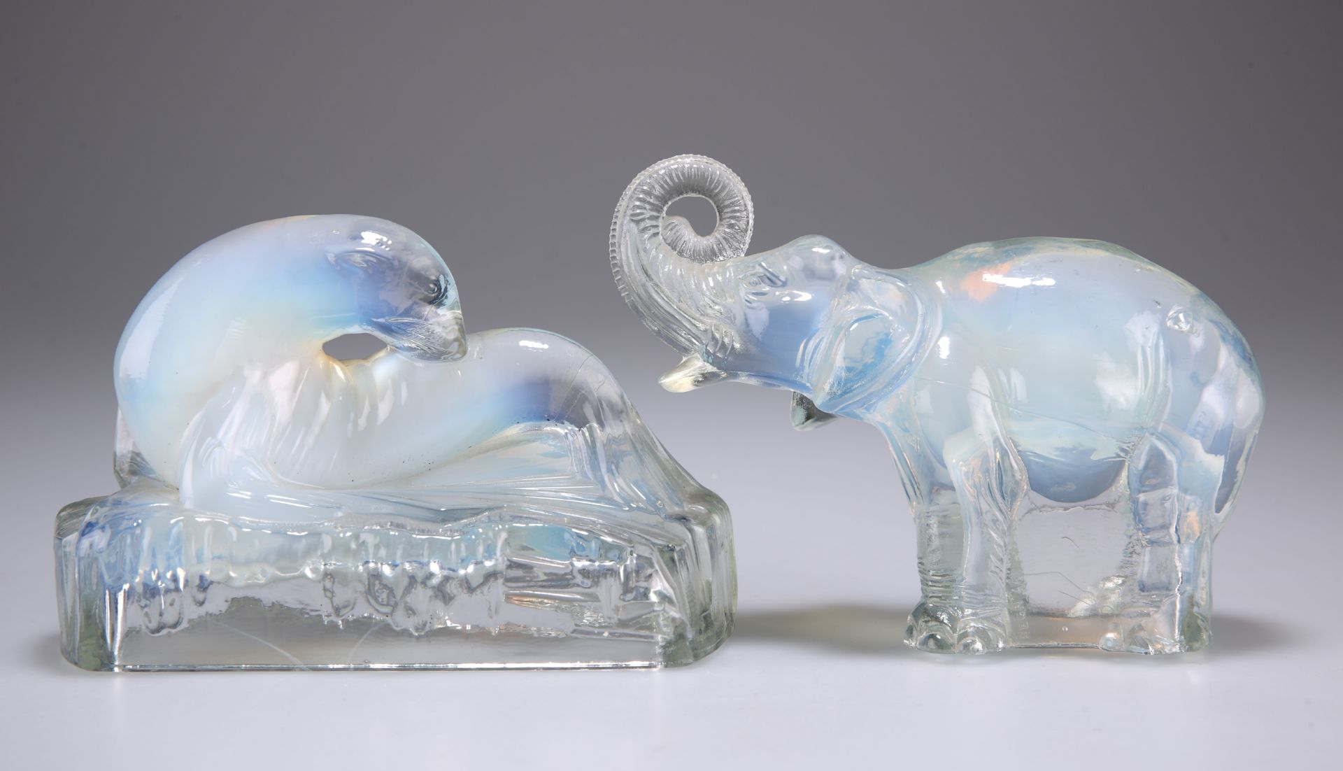 A JOBLINGS OPALIQUE PRESSED GLASS MODEL OF AN ELEPHANT