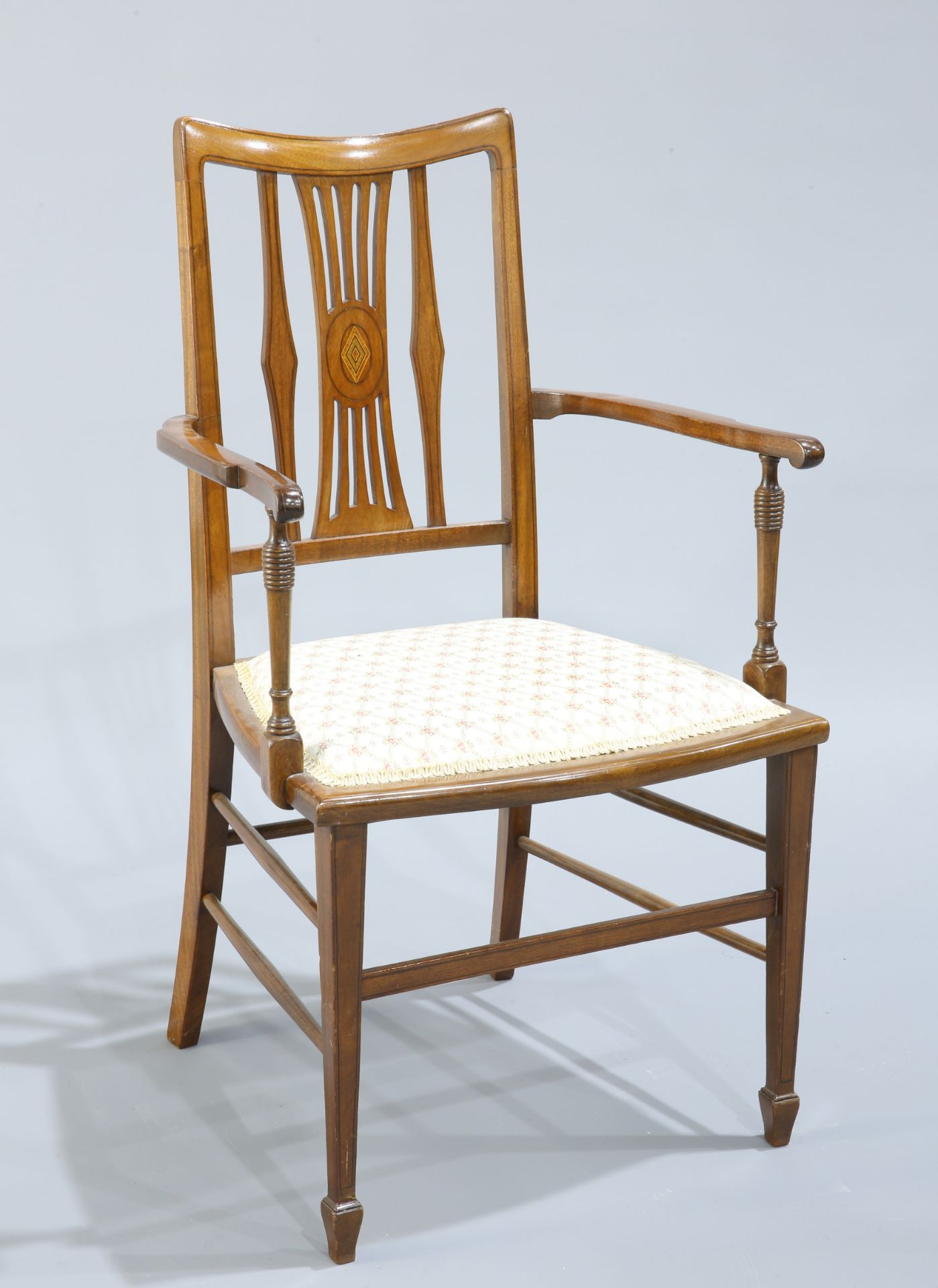 AN EDWARDIAN INLAID MAHOGNAY OPEN ARMCHAIR