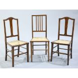 A PAIR OF EDWARDIAN INLAID MAHOGANY CANE SEATED SIDE CHAIRS, with string inlaid splat backs and