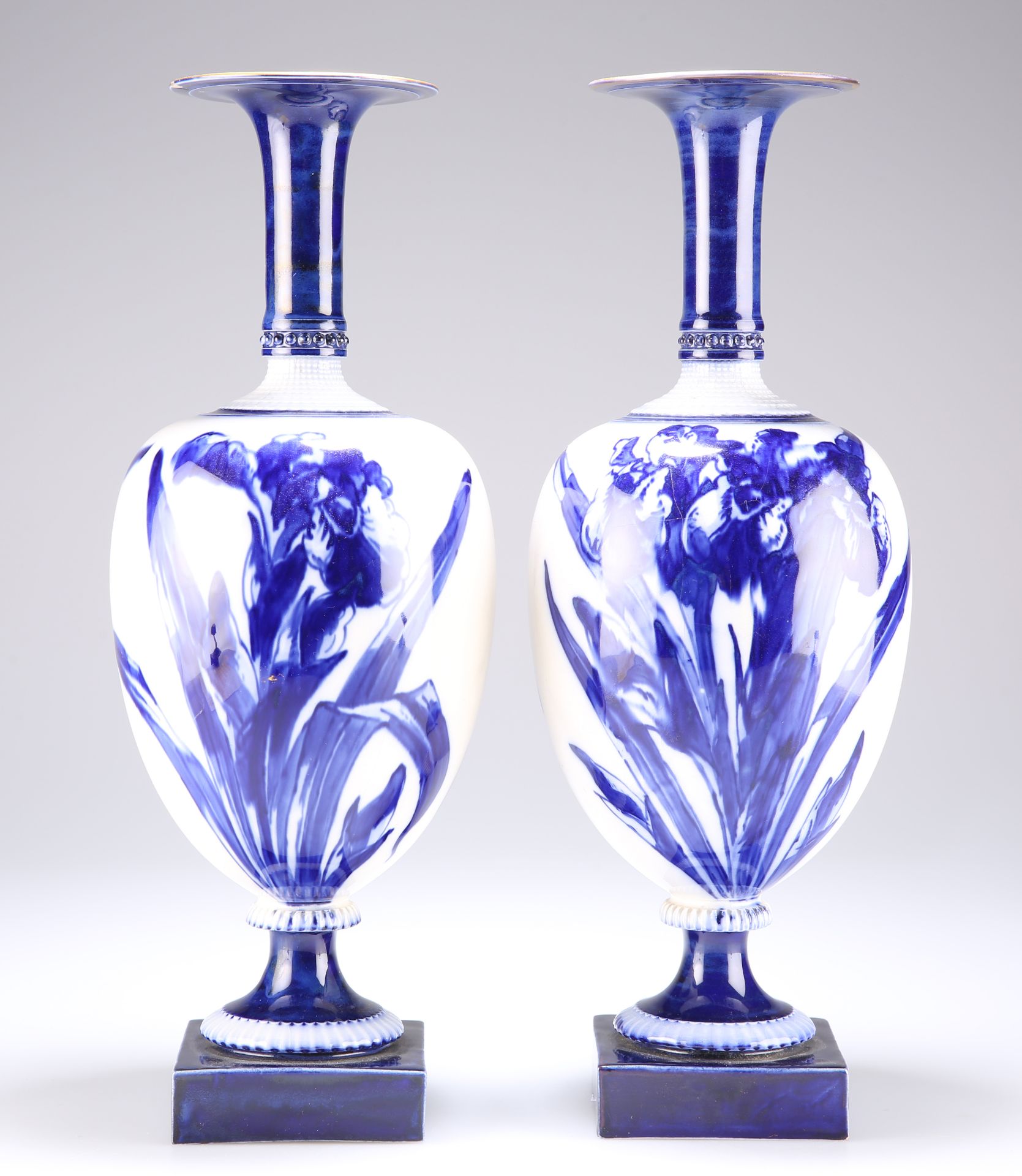 A PAIR OF ROYAL DOULTON FLOW BLUE VASES, EARLY 20TH CENTURY, the onion-shaped bodies decorated - Image 2 of 3